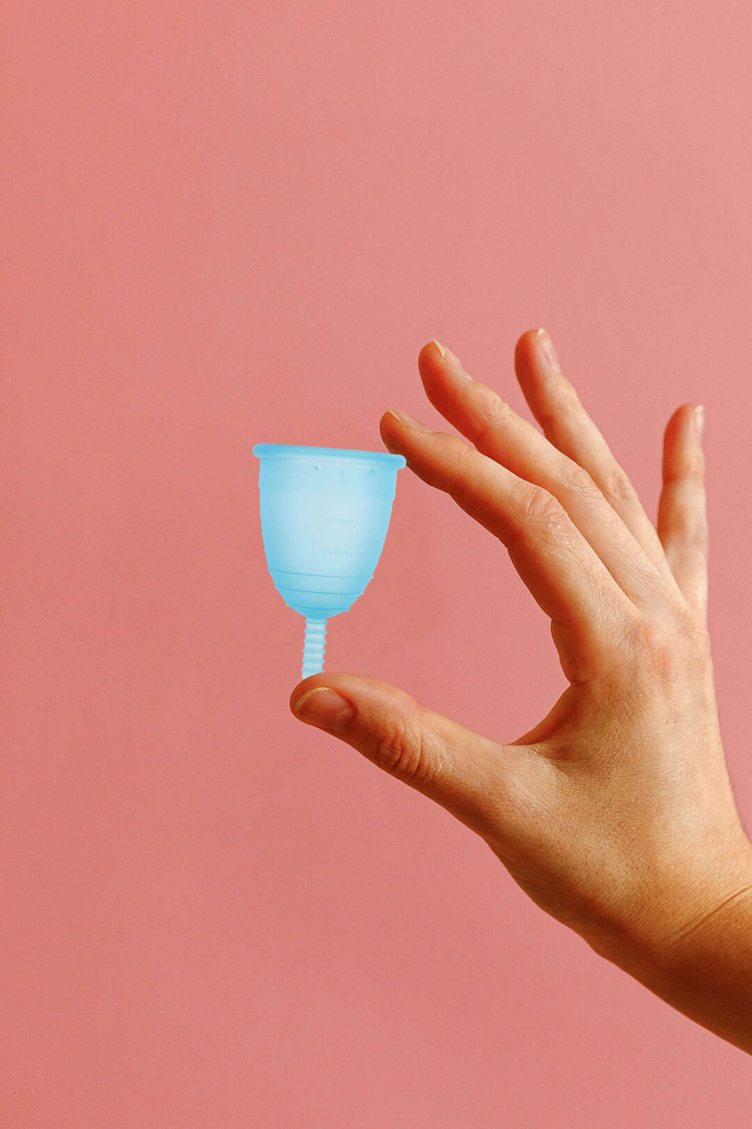 Woman holding a menstrual cup: discover how MamiCup® period cup works